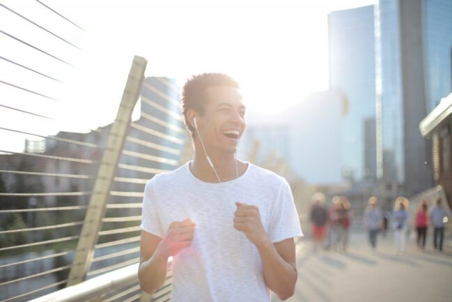 Man smiling and running