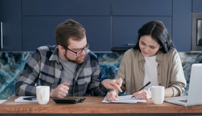 Man and woman checking finances