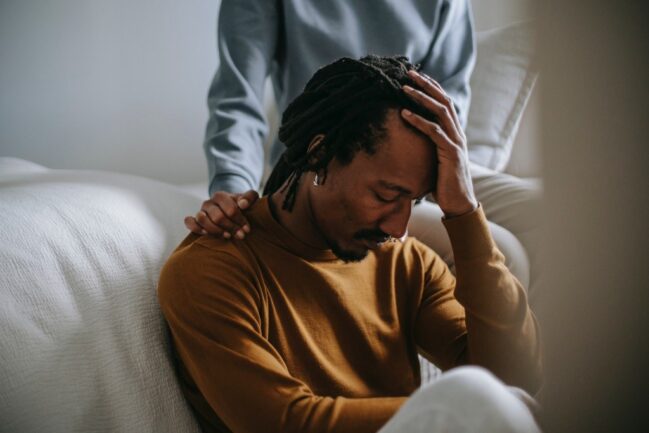 Photograph of a man dealing with grief and loss