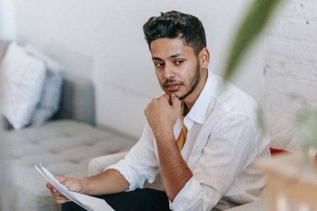 Man thinking on sofa