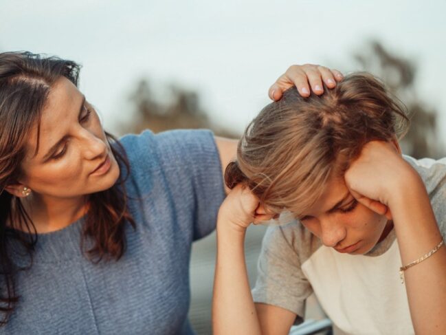 Mum comforting daughter